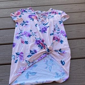 Rose shirt that opens down the middle.